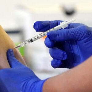 US states blame federal government as vaccine rollout runs behind
